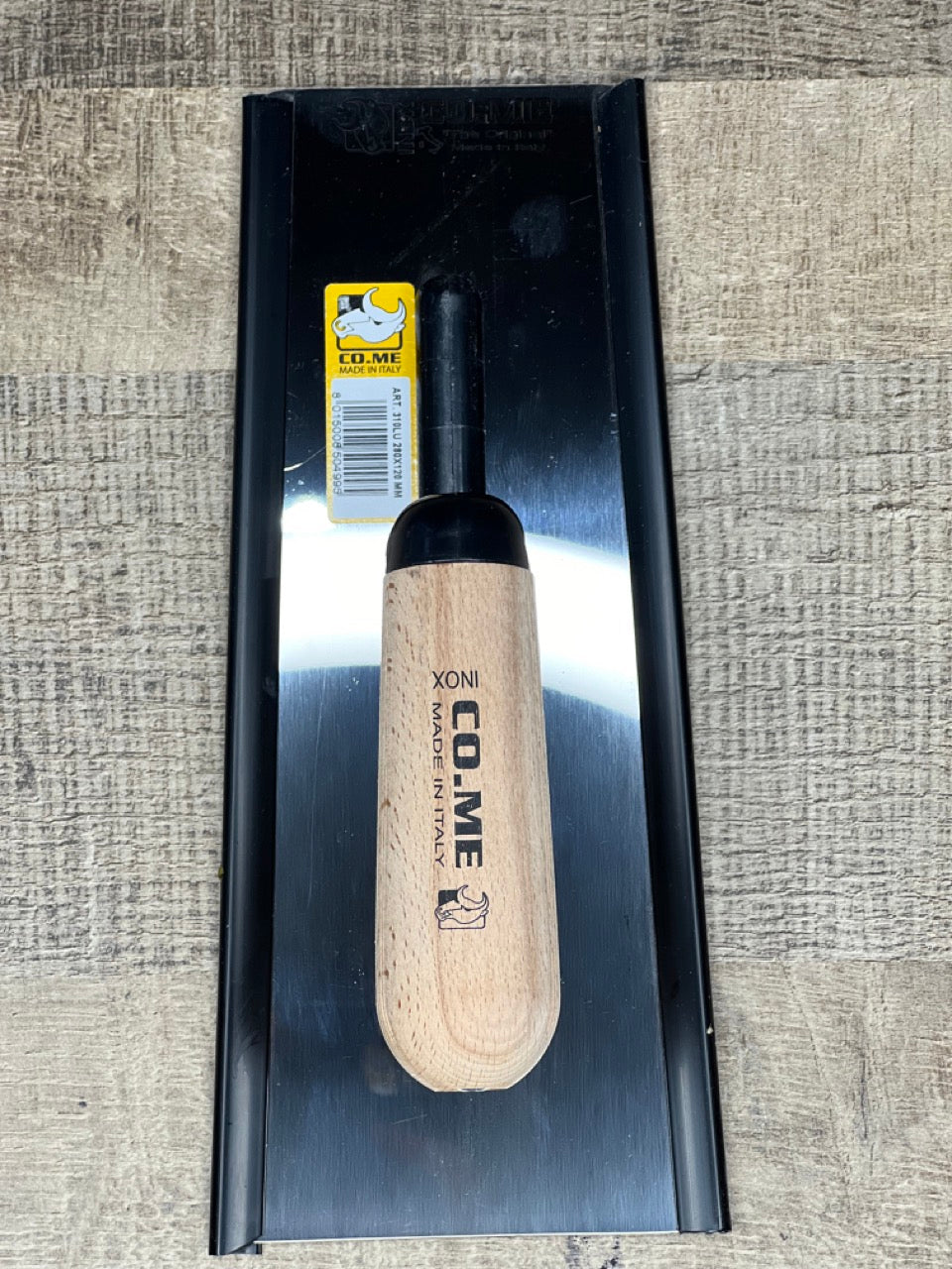spatula with a wooden handle. Trapezoidal shape 280x120 mm