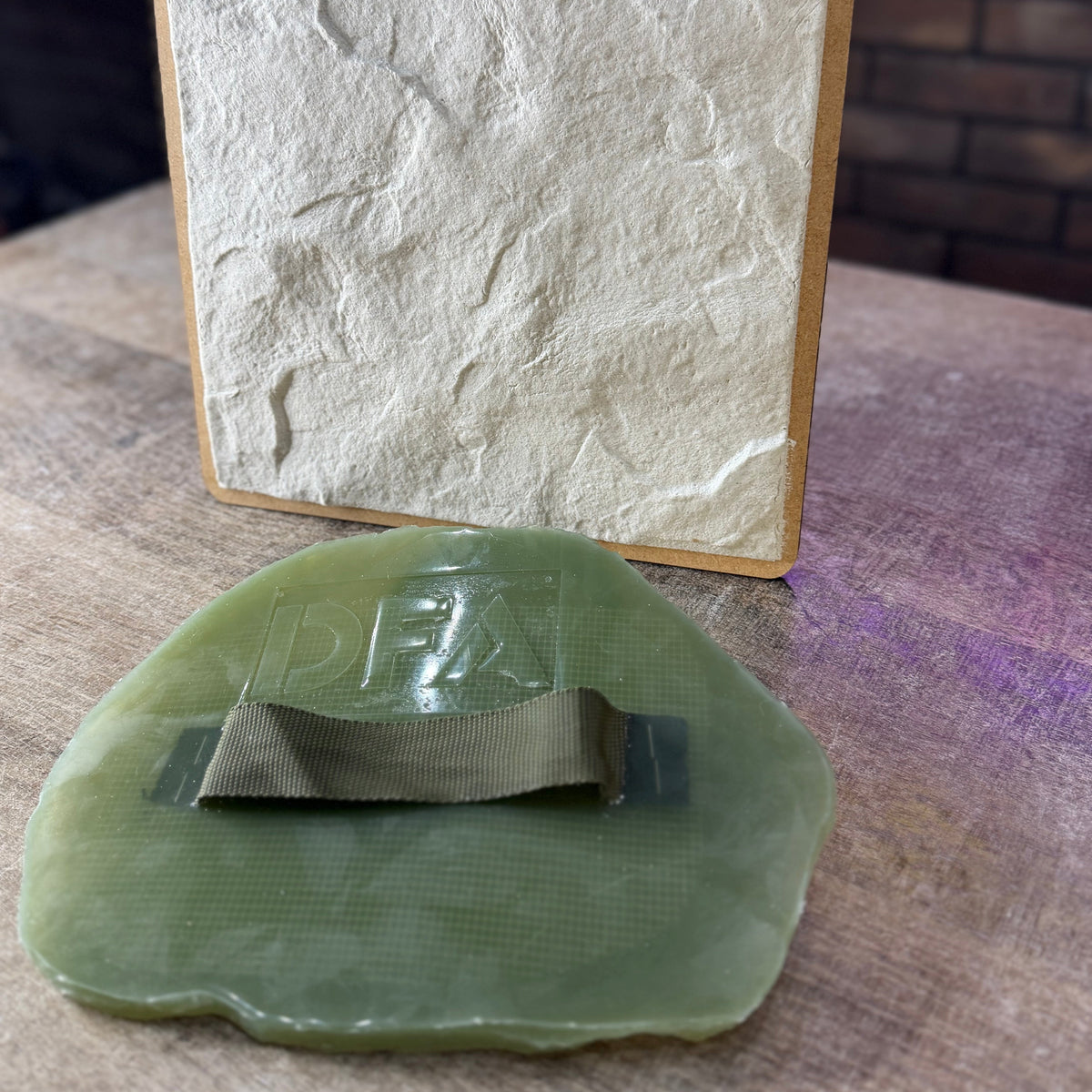 Stone Texture 1 silicone plaster stamp with handle for creating natural stone relief patterns on walls